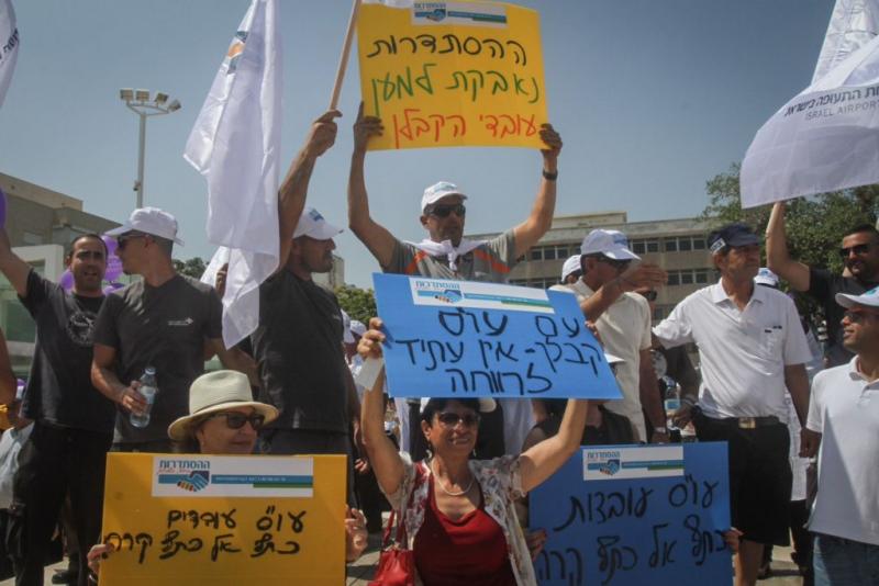 Illustrative: Thousands demonstrate in a protest organized by the Histadrut in support of contract workers, at Habima Square in Tel Aviv, on July 16, 2015. (Flash90)